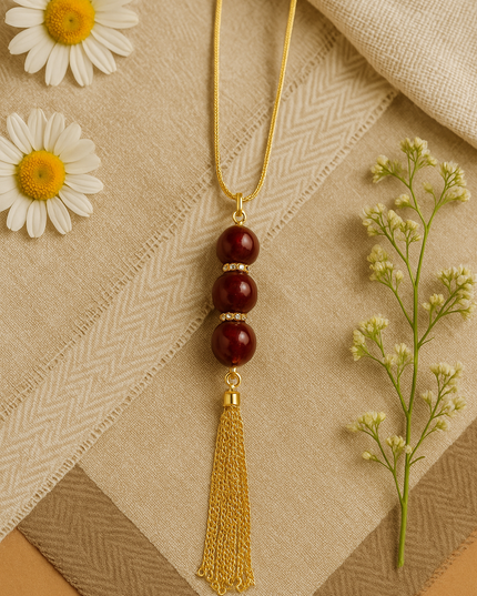 Elegant Gold Tassel Necklace with Maroon Beads