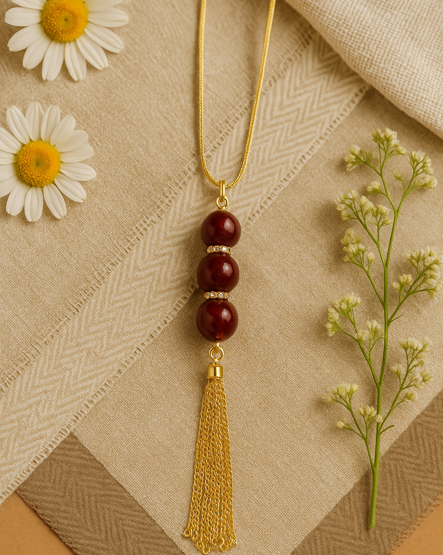 Gold-Tone Tassel Pendant Necklace with Maroon Beads