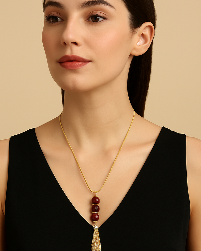 Gold-Tone Tassel Pendant Necklace with Maroon Beads